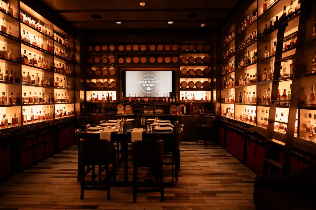 Elegant whiskey room featuring premium spirits and sophisticated ambiance.