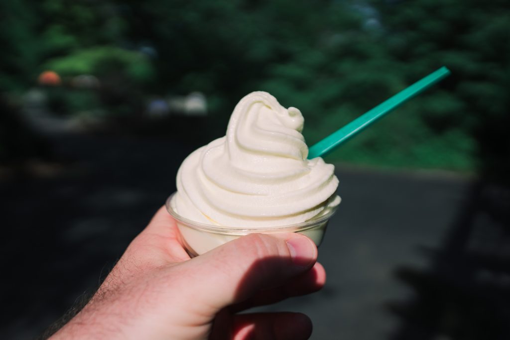 Delicious pineapple Dole Whip dessert served in a tropical setting.