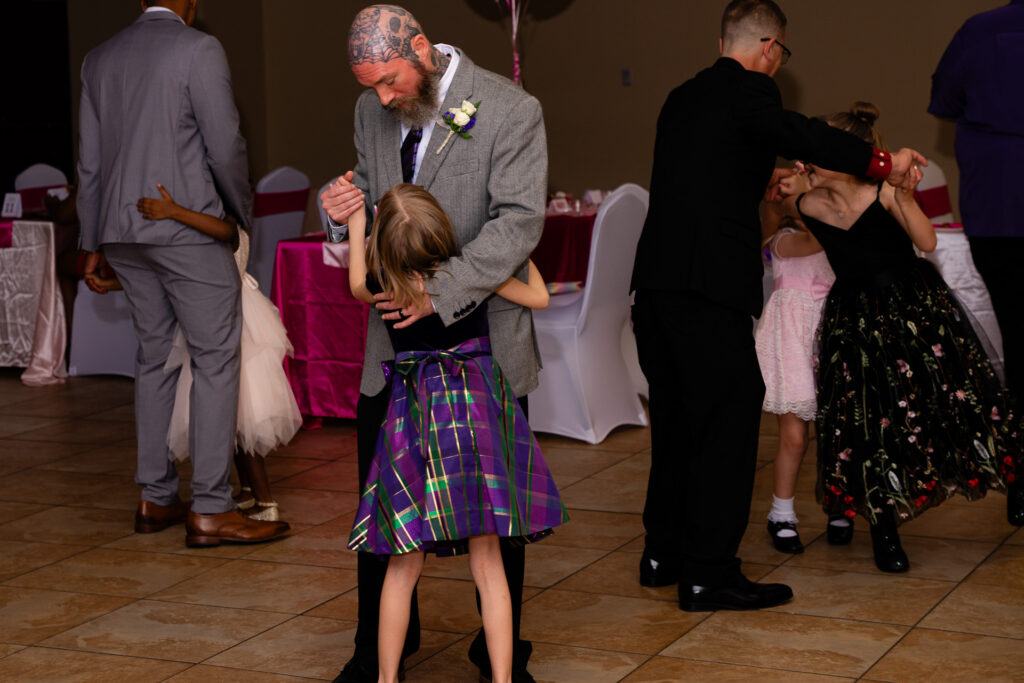 Father and daughter enjoy a memorable dance together at a special event.