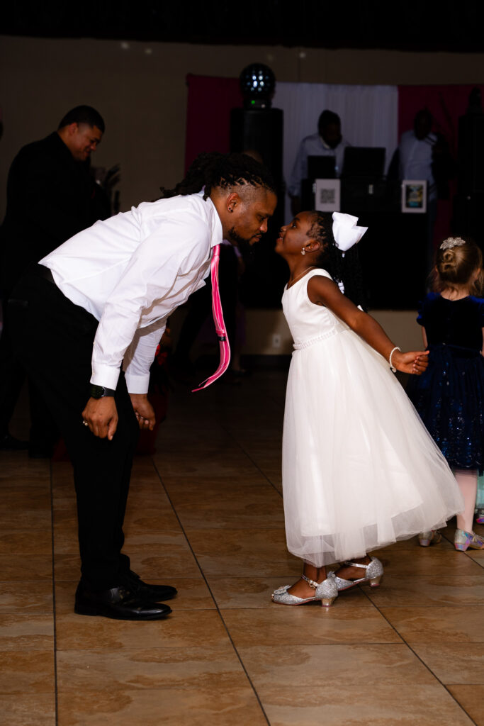 Heartwarming father-daughter dance moment captured at a special celebration event.