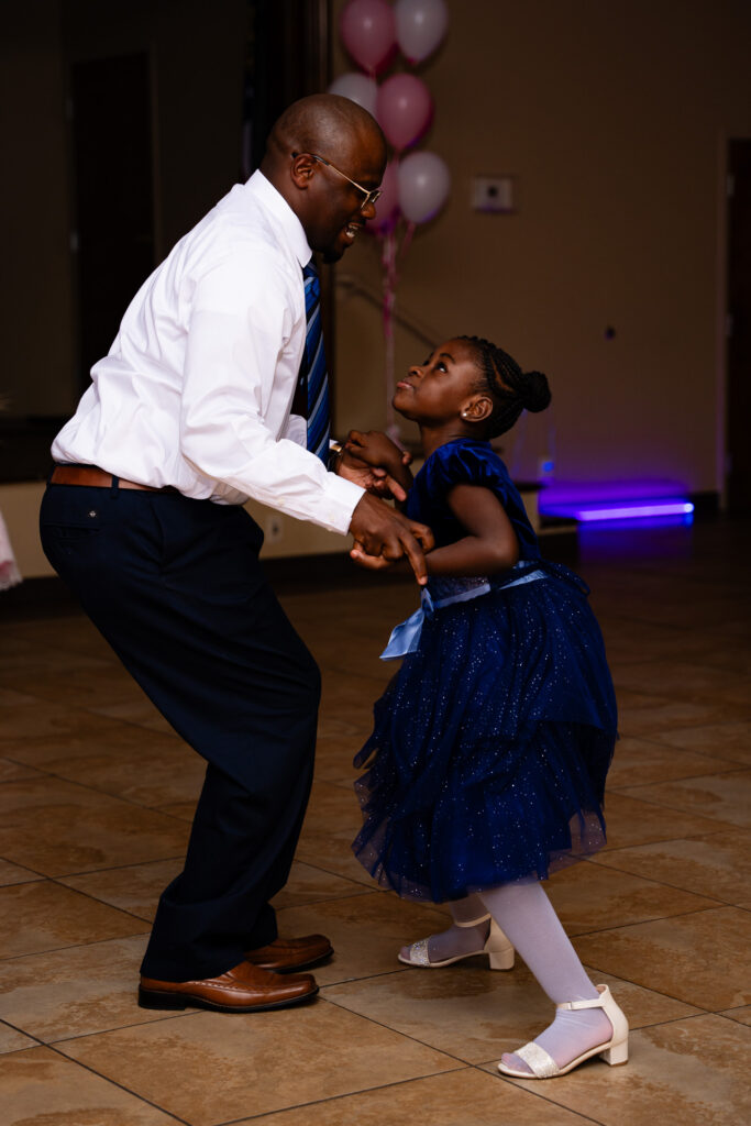 Heartwarming father daughter dance captured in joyful celebration at a memorable event.