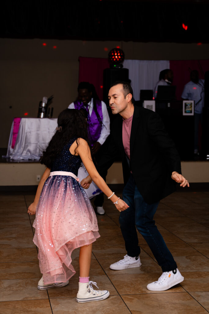 Joyful father-daughter dance captures love and celebration at a memorable event.