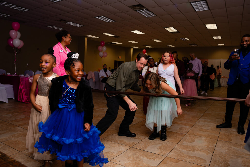 Heartwarming father-daughter dance moment captured in a joyful celebration.